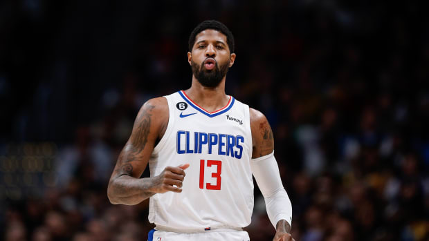 Clippers guard Paul George runs down the court.